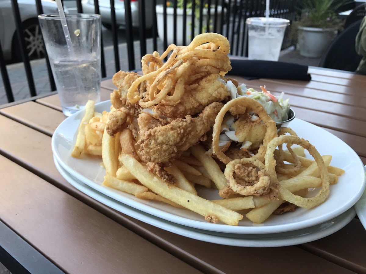 Fried fish and chips with onion straws