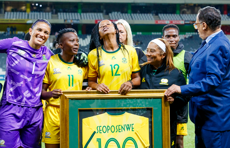 Jermaine Seoposenwe receives a jersey commemorating her 100th cap as Banyana Banyana meet Tanzania in their 2024 Paris Olympic Games qualifying match at Mbombela Stadium on on Tuesday night. Picture: DIRK KOTZE/GALLO IMAGES