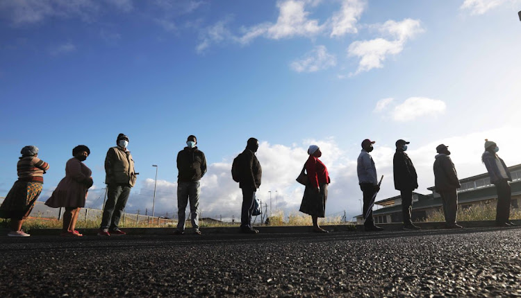 Voters queue in Macassar, Khayelitsha, to cast their votes.