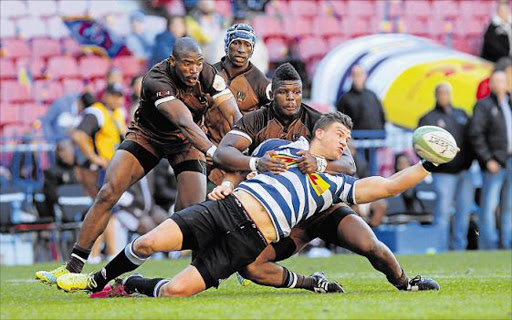 ALL IN HAND: John Ben Kotze of Western Province hangs on to the ball during their Currie Cup qualifying match against the Border Bulldogs at Newlands. Border went down 52-26 and will be out to make amends against Free State tonight Picture: GALLO IMAGES