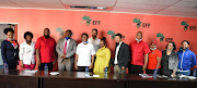 The EFF and Unilever officials posed for a picture after reaching an agreement that TRESemmé products could remain on South African store shelves. 