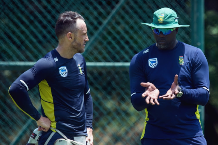 SA senior men's national cricket team captain Faf du Plessis (L) in a discussion with head coach Ottis Gibson (R) during a training session at Pallekele International Cricket Stadium on August 03, 2018 in Balagolla, Sri Lanka.