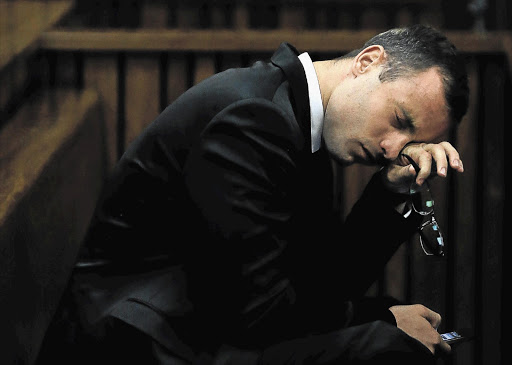 Oscar Pistorius in the Pretoria High Court before he took the stand for the first time in his trial for the murder of Reeva Steenkamp. He spoke of his long-term terror of criminals.