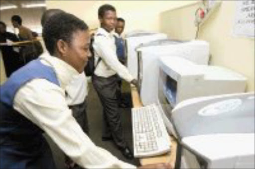 CONNECTED Jabulile Tshabalala, 13, a Grade 7 pupil at Isulihle Primary School at the Emndeni Community Technology Centre relaunch in Soweto. 22/11/07. © Sowetan.