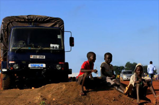 Children displaced by war in South Sudan play by a United Nations High Commissioner for Refugees (UNHCR) truck at the Palabek Refugee Settlement Camp in Lamwo district, Uganda June 16, 2017. /REUTERS