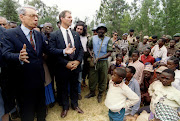 Then UN secretary-general Boutros Boutros-Ghali talks to survivors of the massacre at Nyarubuye on July 14 1995, during a brief visit to the church in which hundreds of Tutsis were massacred by Hutu militias in 1994. Boutros-Ghali told them that he shared their grief and that the guilty would be punished.