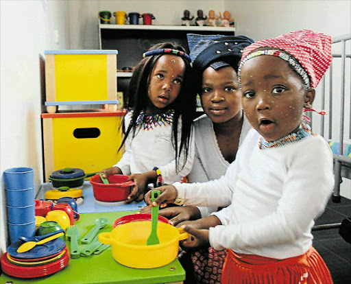 FUTURE DOCTORS: My Little World pre-schoolers Siyolise Nyingwa and Mihlali Pala, both four years old, show their new school to Mihlali's mother, Andisiwe Pala, during Heritage Day celebrations on Friday. Picture: SIKHO NTSHOBANE