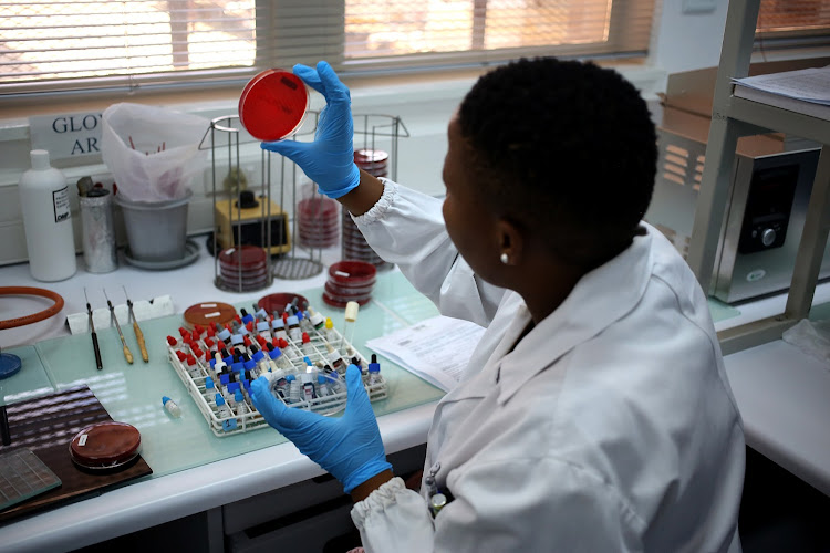 Medical technologist Bolele Disenyeng, seen in a lab at The National Institute for Communicable Diseases in Johannesburg. The institute is dealing with the listeriosis outbreak in South Africa.