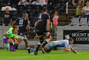 Johnny Kotze of the Vodacom Bulls scores during the Super Rugby match between Cell C Sharks and Vodacom Bulls at Jonsson Kings Park Stadium Stadium.