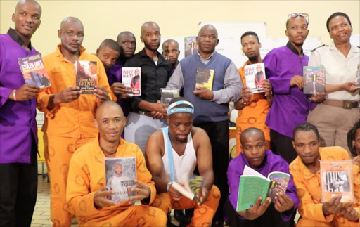 NEW PAGE: Former inmate and author Mzukisi Silandela, black shirt, donating 50 books to the West Bank Maximum Prison. Picture: BHONGO JACOB