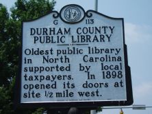 Oldest public library in North Carolina supported by local taxpayers. In 1898 opened its doors at site 1/2 mile west.Plaque via North Carolina Highway Historical Marker Program, and is used with...