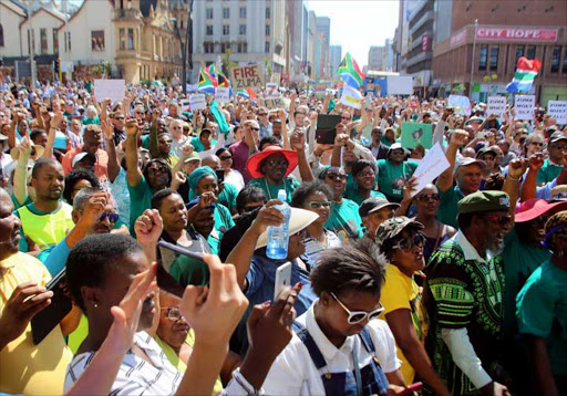 STANDING UP: Crowd listens to Sipho Pityana addressing the Save SA gathering held at Vuyisile Square at the City Hall Picture: BRIAN WITBOOI