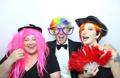 A photo of friends at a charity event taken in a photobooth