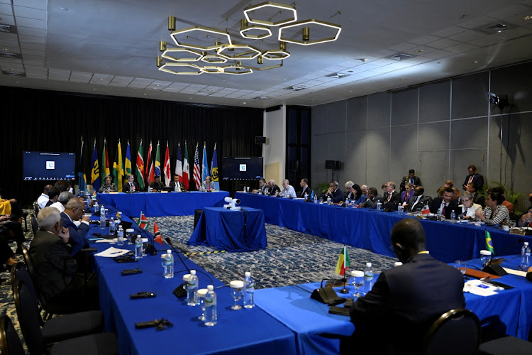 (L-R back table) Barbados Prime Minister Mia Mottley, US Secretary of State Antony Blinken, Guyana President Irfaan Ali and Jamaican Prime Minister Andrew Holness attend an emergency meeting on Haiti at the Conference of Heads of Government of the Caribbean Community in Kingston, Jamaica.