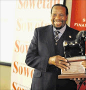 LEGEND: Richard Maponya receives a life time achievement award at the Entrefpreneurship Summit in Soweto yesterday. Pic. Peter Mogaki. 22/04/2010. © Sowetan.