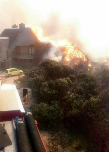 The four-star Bezweni Lodge goes up in flames as wildfires sweep through Somerset West on Wednesday. The picture was posted on the lodge's Facebook page.