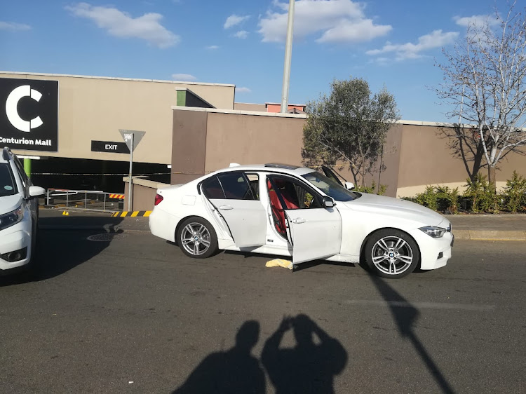 The BMW was cornered outside the mall after a shoot-out with pursuing police.