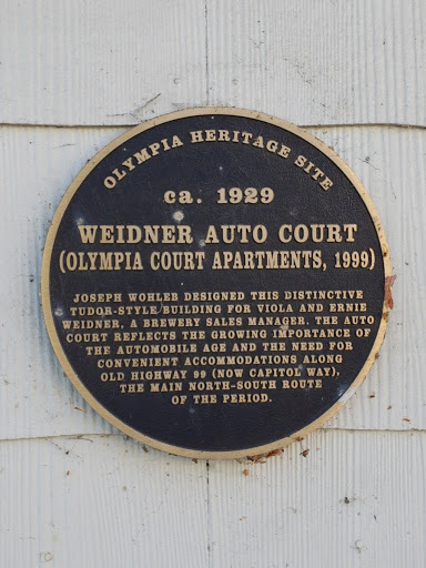 OLYMPIA HERITAGE SITE ca. 1929  WEIDNER AUTO COURT  (OLYMPIA COURT APARTMENTS, 1999)  JOSEPH WOHLEB DESIGNED THIS DISTINCTIVE  TUDOR-STYLE/BUILDING FOR VIOLA AND ERNIE  WEIDNER, A BREWERY SALES...