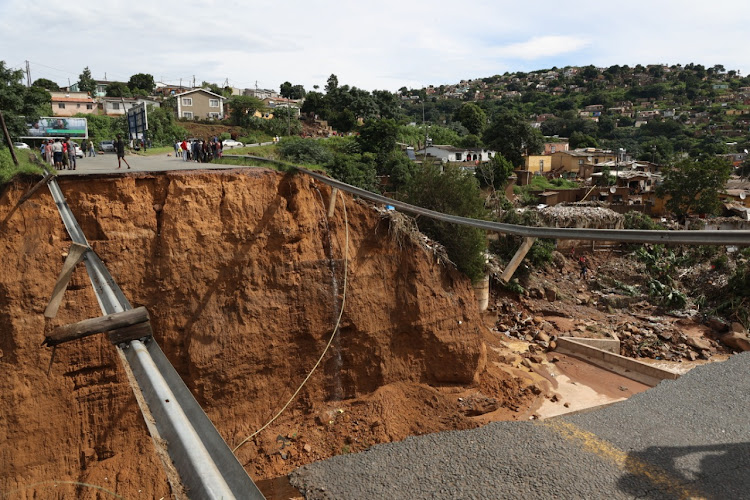 A 15m-wide hole where a bridge once stood in Ntuzuma in KwaZulu-Natal. Some farmers were hit hard, with a farmers' association saying it will cost at least R91m to replant eroded crops and repair damaged infrastructure.