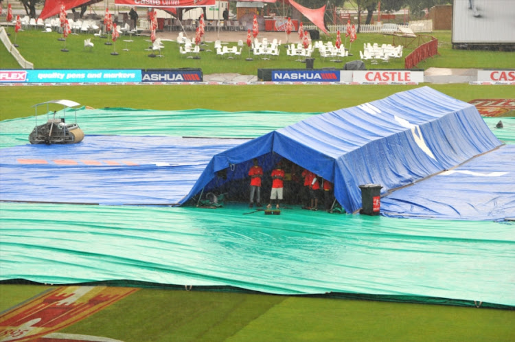 Groundstaff waiting in the rain under a tent at SuperSport Park in Centurion, South Africa. File photo