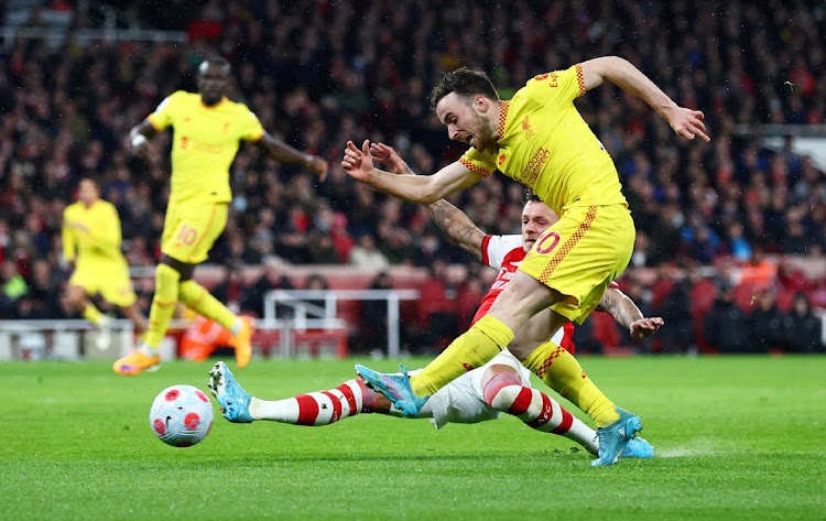 Liverpool's Diogo Jota scores their first goal against Arsenal.