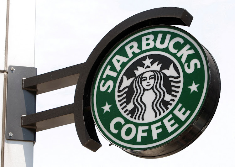 The Starbucks sign is seen outside one of its stores in New York, New York, US. Picture: CHIP EAST/REUTERS