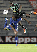 Thabo September of Supersport United is beaten to the ball by Bloemfontein Celtic's Vuyani Ntanga during the teams' Absa Premiership clash at Lucas Moripe Stadium in Atteridgeville last night Picture: SYDNEY SESHIBEDI