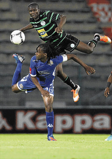 Thabo September of Supersport United is beaten to the ball by Bloemfontein Celtic's Vuyani Ntanga during the teams' Absa Premiership clash at Lucas Moripe Stadium in Atteridgeville last night Picture: SYDNEY SESHIBEDI
