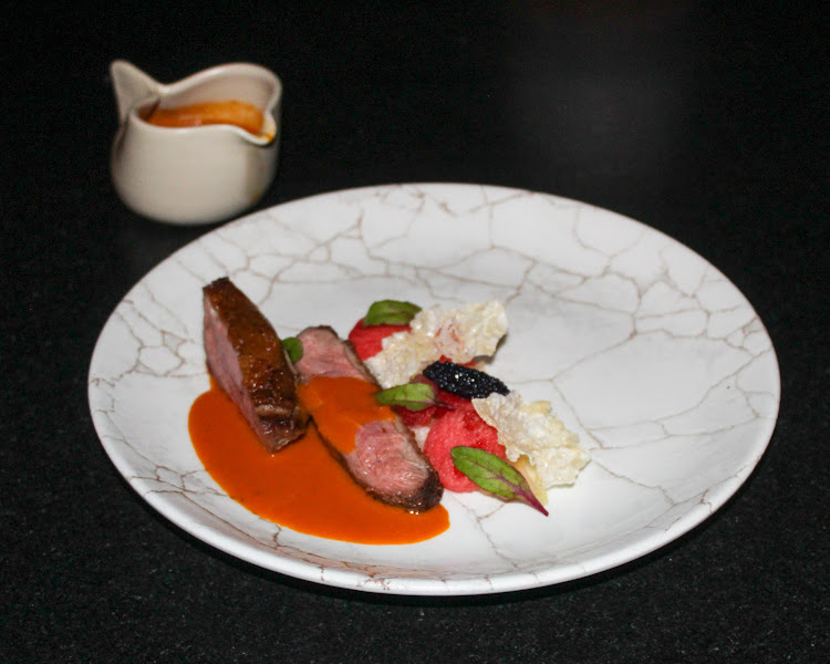 Duck breast with textures of watermelon and curry.