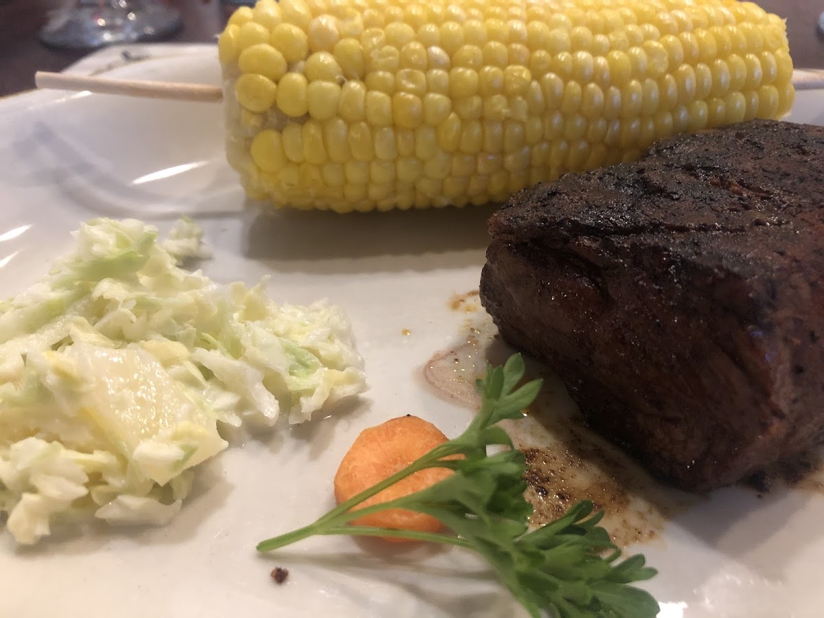 7 oz. steak with corn and cole slaw.