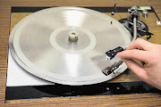 HIS MASTER'S VOICE: A master copy of a vinyl record is tested to ensure its quality before being replicated at The Vinyl Factory in Hayes, England