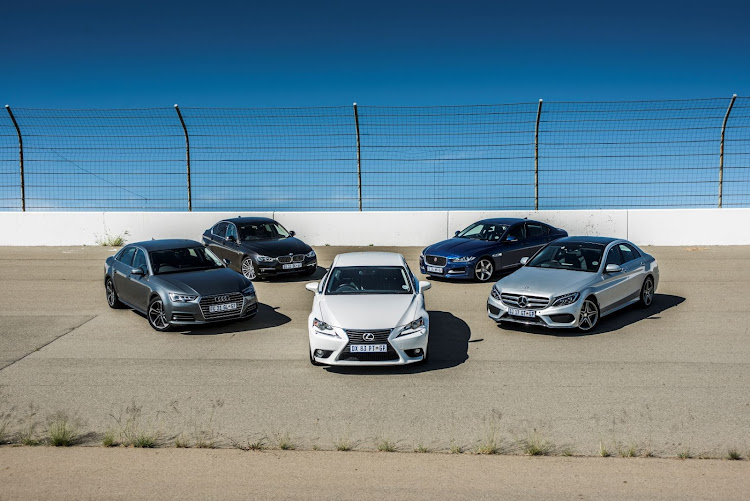 Our five executive sedans on the banking at Phakisa.