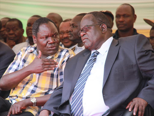 Kasipul MP who is also eyeing the Homa Bay governor seat Oyugi Magwanga with governor Cyprian Awiti.Pix habil Onyango