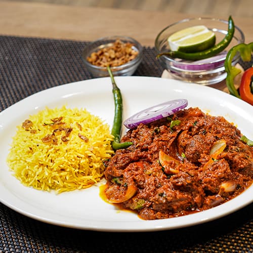 Sherpa Tarkari: Slow Cooked lamb, Onion, bellpepper cooked with himalayan spices.