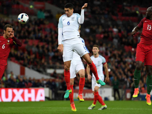 Smalling beats Ricardo Carvalho (6) and Danilo Pereira of Portugal to score at Wembley./sky sports