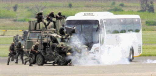 RAPID RESPONSE: Members of the SA National Defence Force simulate a rescue mission during the 90th anniversary celebrations in Pretoria on Friday. Pic. Veli Nhlapo. 31/01/2010. © Sowetan.