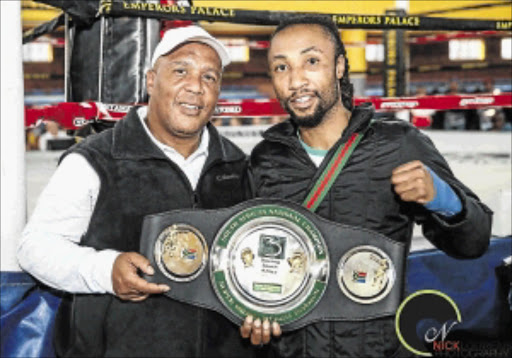 'SHOW ME THE MONEY': Trainer Keith Rass has accused promoter Siphatho Handi for failing to pay boxers, including his charge Bongani Mahlangu, their purse money after a tournament in East London last month. Mahlangu is new SA champ PHOTO: Nick Lourens