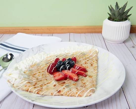 Tutti Frutti Crepe: Embark on a berrylicious journey: vibrant raspberries, juicy blueberries, and ripe strawberries dance with smooth white chocolate. Topped with a dollop of heavenly whipped cream, it's a taste sensation you won't forget!
