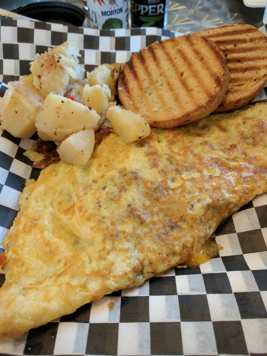 bacon and cheese omelette with potatoes and biscuit