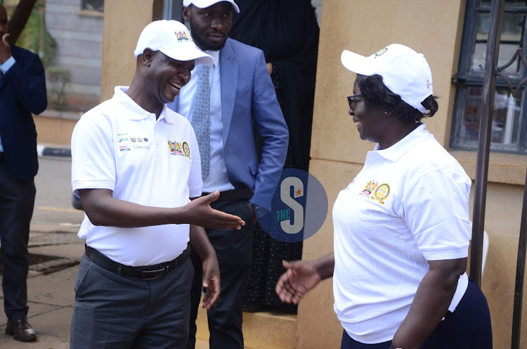 Chief Magistrate Lucas Onyina and Susan Shitubi during the traffic open day flag off at Milimani Law Courts on March 20, 2024.