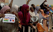 Women supporters of the military administration in Niger demonstrate at a French military air base in Niamey, demanding French soldiers leave Niger.