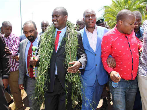 Uasin Gishu Deputy Governor Daniel Chemno and Governor Jackson Mandago (in red tie) in Eldoret town on Wednesday / MATHEWS NDANYI