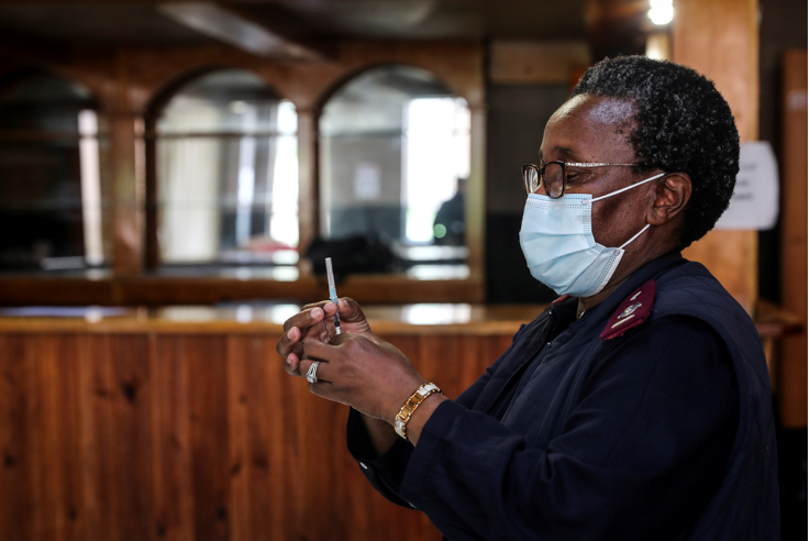 A healthcare worker prepares a dose of the Pfizer coronavirus vaccine amid the spread of the Omicron variant in Johannesburg on December 9 2021.