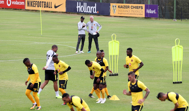 Kaizer Chiefs' German coach Ernst Middendorp (R) in a discussion with the club's reserve team head coach Arthur Zwane during a training session at their base in Naturena, south of Johannesburg, on December 10 2018.