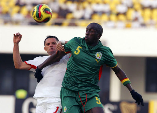 Dos Santos of Tunisia and Souleymane Diawara of Senegal during the Group D AFCON match between Tunisia and Senegal held at the Tamale Stadium on January 23, 2008 in Tamale, Ghana