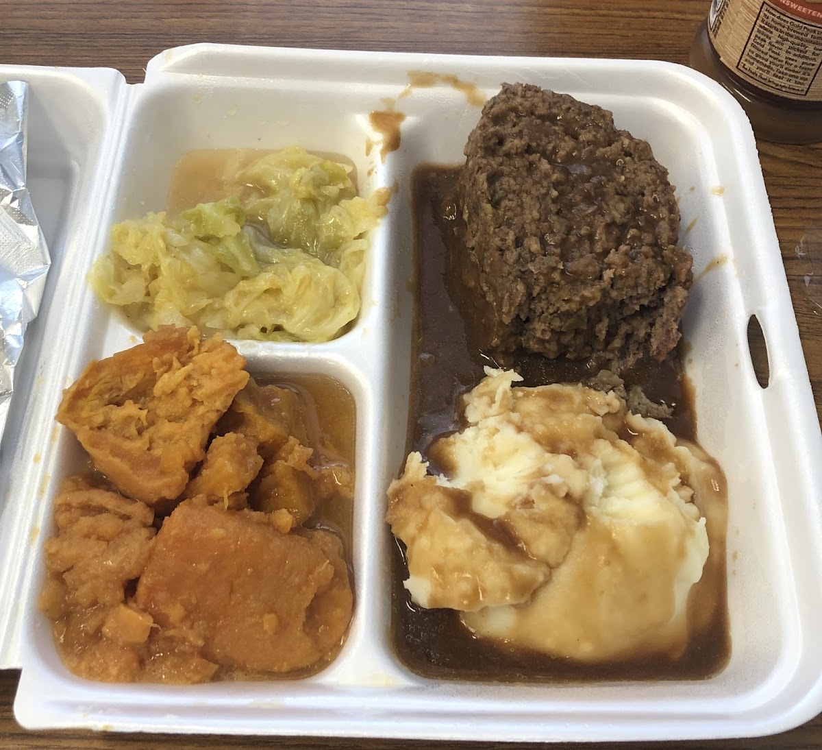 Great Labor Day meal with meatloaf, mashed potatoes w/ gravy, cabbage, and yams. Great to have meatloaf with just meat and veggies in it!