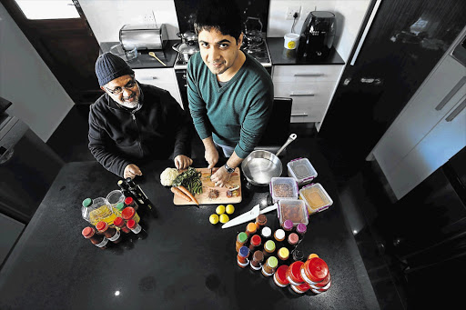 SPICE BOYS: Shakeel Parker and his father, Riyaaz, prepare pickled lemons at their home in Rylands, Cape Town