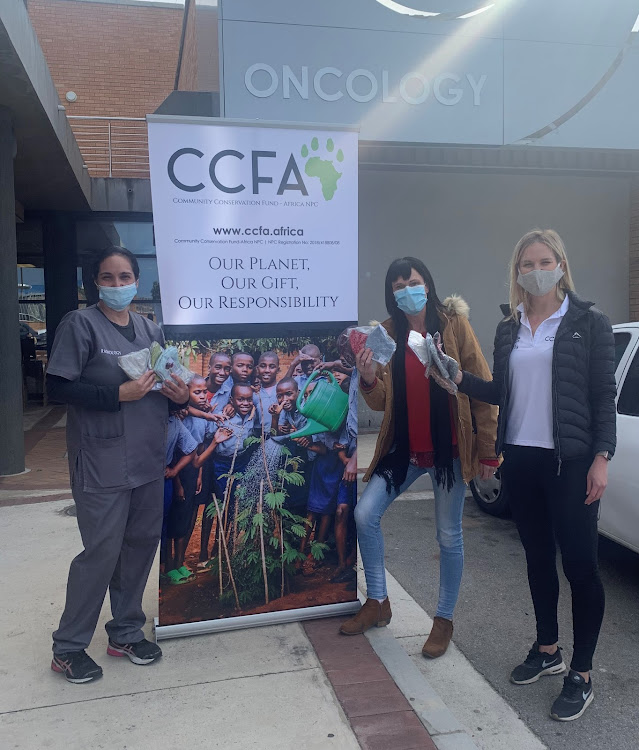Community Conservation Fund Africa donate 500 masks as an early Mandela Day gift to Livingstone Hospital. At the handover are, from left, chief radiographer Vernolia Campher, the fund's executive director, Di Luden, and Tania Muthen