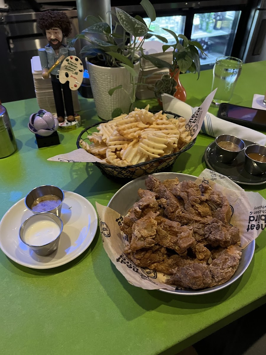 Basket of fries with 10ct chicken strip. Sauces are honey mustard and ranch and then ranch and miso ginger. (Miso ginger is not a gf sauce, others are). Good portions for the price!