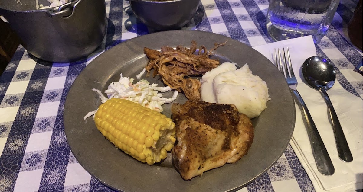 Baked chicken, pulled pork, and sides